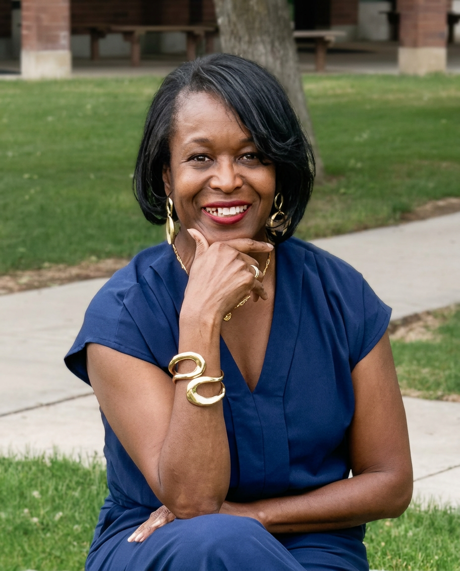 Dana Bagnall, founder of Ultimate Wellness Journey™, seated in a quiet reflective portrait